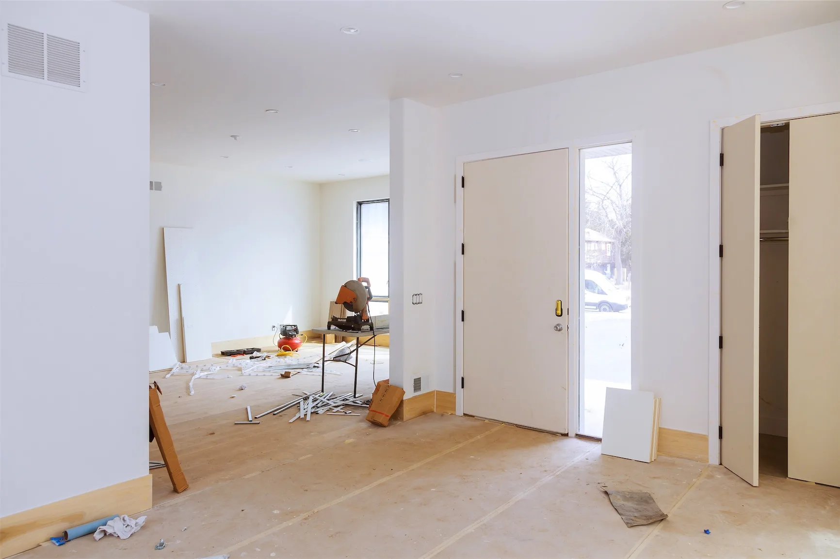 Drywall up and subfloor exposed in a lower level