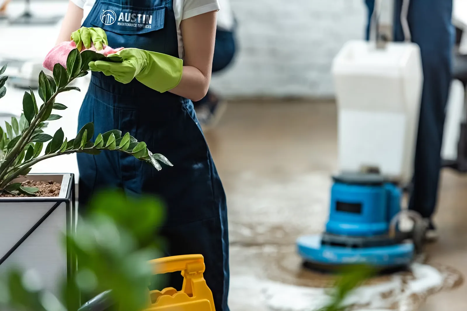 Team member cleaning a commercial floor