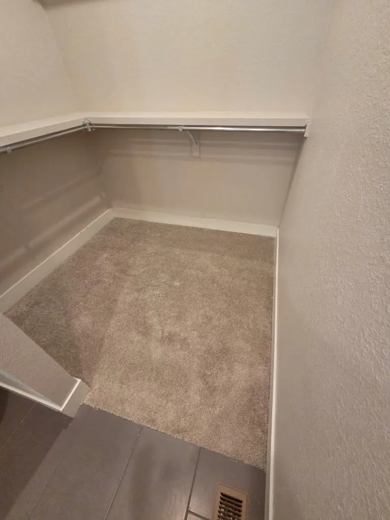 Corner of a clean carpeted room